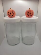 Pair Of Anchor Hocking Glass Storage Canisters with Pumpkin Head Toppers picture