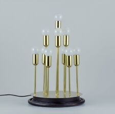 Sülken Leuchten. Modern lamp for ten bulbs. Brass on a black wooden base. picture