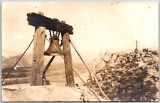 Bell Hanged On Wooden Stand Rocky Mountain Crucifix Real Photo RPPC Postcard picture