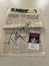 Telly Savalas Autographed Newspaper JSA Certified Authentic. Beautiful Auto picture