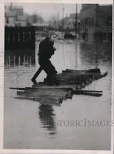 1937 Press Photo Little Boy Floats On Raft During Wheeling West Virginia Flood picture