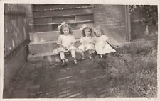 RPPC Real Photo Postcard Three little Girls in a Row Sitting on Steps Kruxo 1909 picture