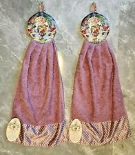 Two Decorative Kitchen Towels By Michal Negrin Light Purple Color With Flowers. picture