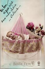 RPPC Adorable Infant Child Baby Lace Outfit In Cradle Pink Floral Roses Postcard picture