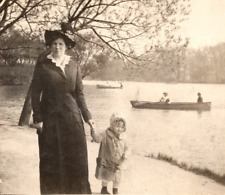 c1914 RPPC Mother Walks w/ Kid Near Water Boats In Background ANTIQUE Postcard picture