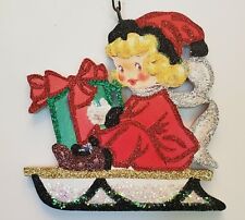 GIRL in RED on SLED w WRAPPED GIFT  * Glitter CHRISTMAS ORNAMENT *  Vtg Img picture