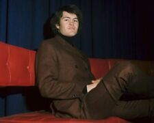 The Monkees Micky Dolenz in brown suit seated on sofa 8x10 inch photo picture