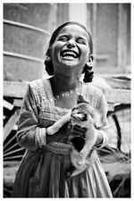 Vintage Photo reprint of a Joyful Child Little Girl Happy to Have a Kitten Cat  picture