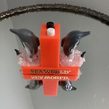 Plastic Souvenir Sea World Orange Dolphins Button Press Salt & Pepper Shakers picture