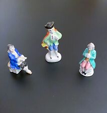 Vintage Occupied Japan Figurines 3 Piece Lot, Flute Man, Colonial Man, Piano Man picture