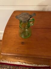 Green depression glass syrup pitcher with metal lid picture