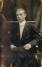 Young Man in Suit Sitting in Chair RPPC c 1915 Postcard picture