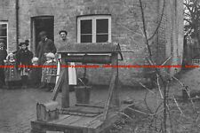 F000859 Photo of family outside house with well and bucket. c1900s. Image shot 1 picture