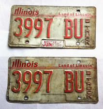 1992 Illinois Land of Lincoln Red White Metal Expired License Plate 3997 BU picture