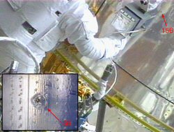 Orbital debris damage seen during Hubble Space Telescope repairs.