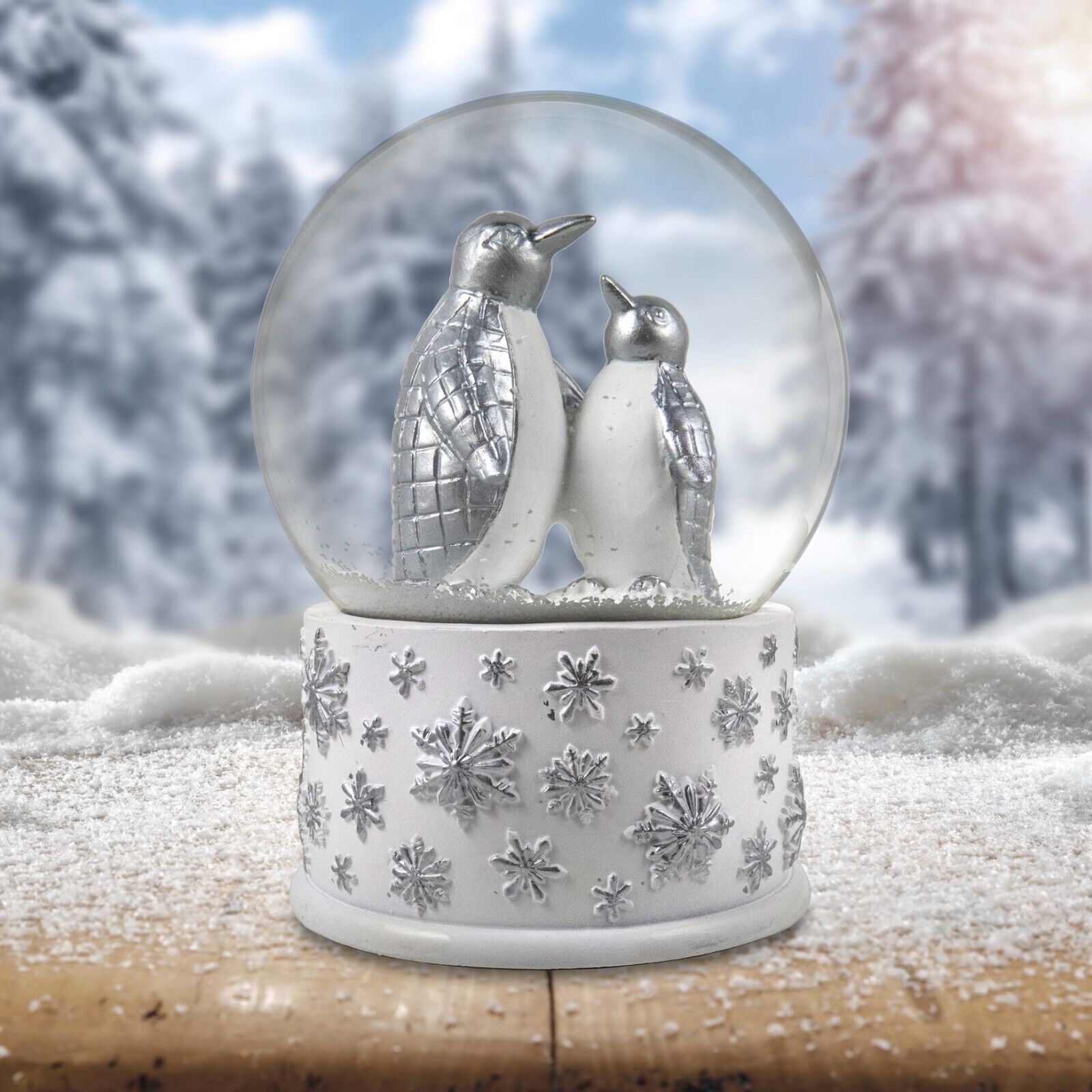 100mm Silver Penguins Playing Snow Globe by The San Francisco Music Box Company