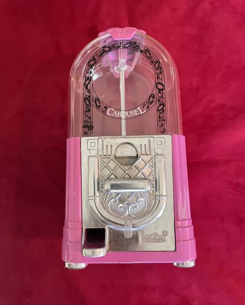 Vintage Pink Carousel Gumball Machine In Perfect Working Order.
