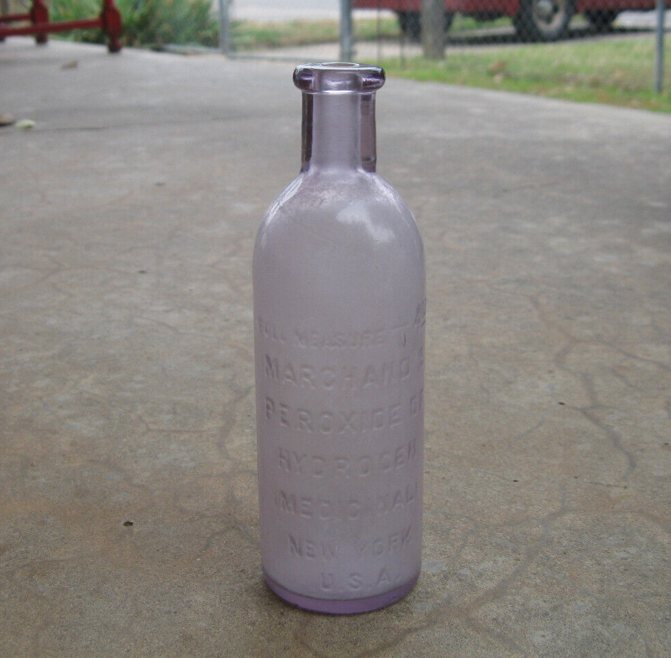 Antique Amethyst Colored Marchand\'s Peroxide of Hydrogen 4 oz Glass Bottle
