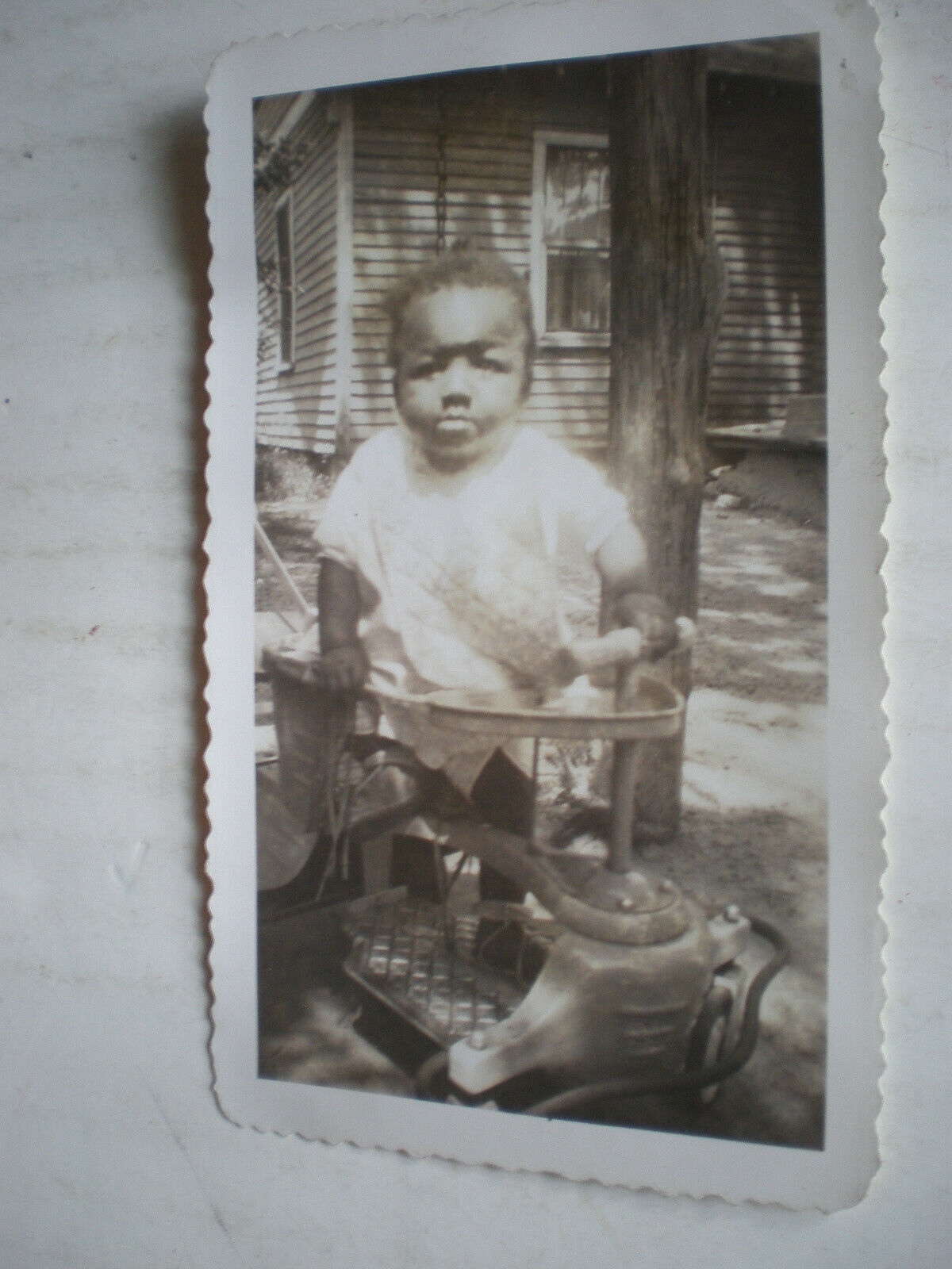 VIntage African American Baby With Vintage Metal Looking Toy Photograph Picture