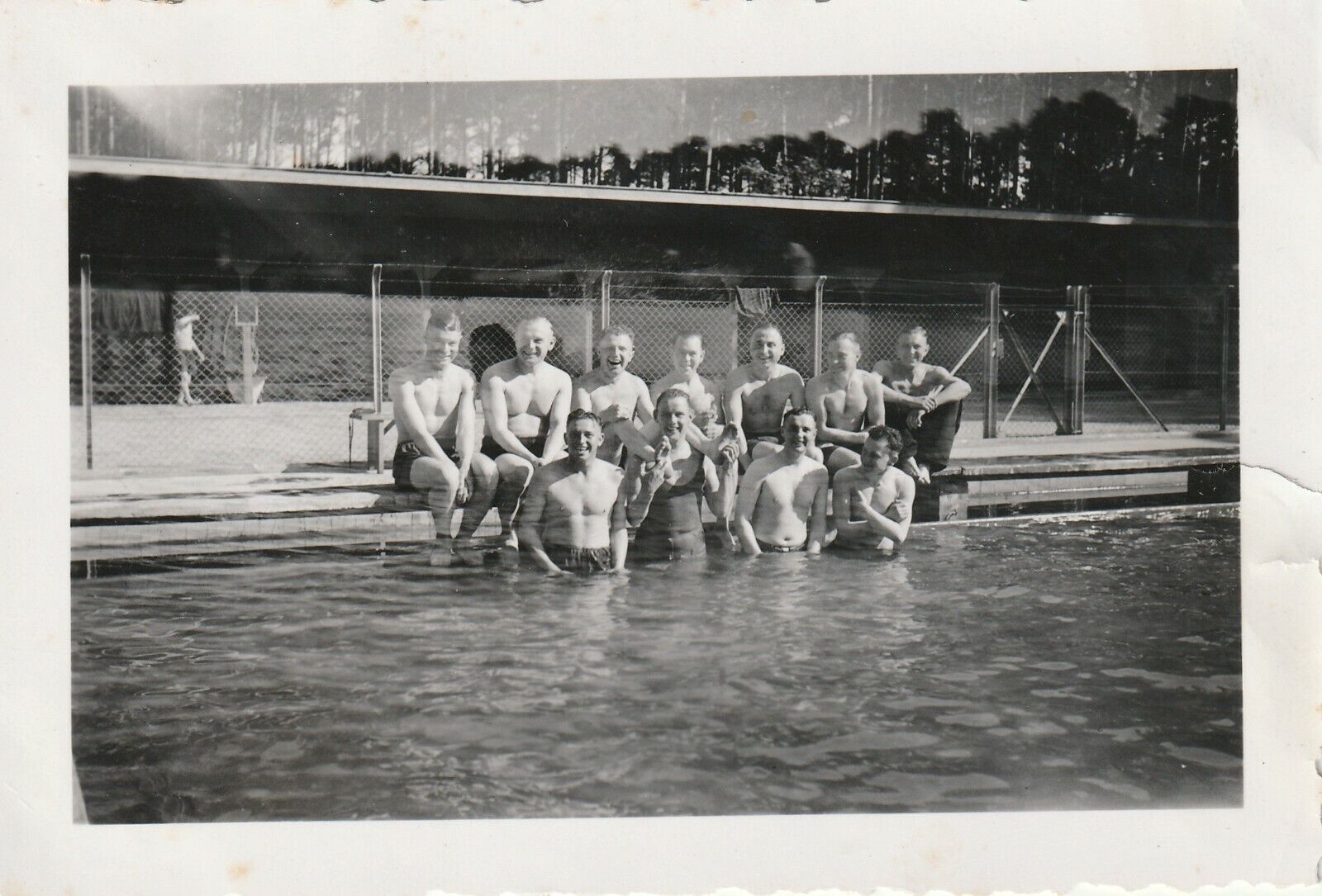 Vintage photograph, shirtless mature men at swimming pool, gay interest 