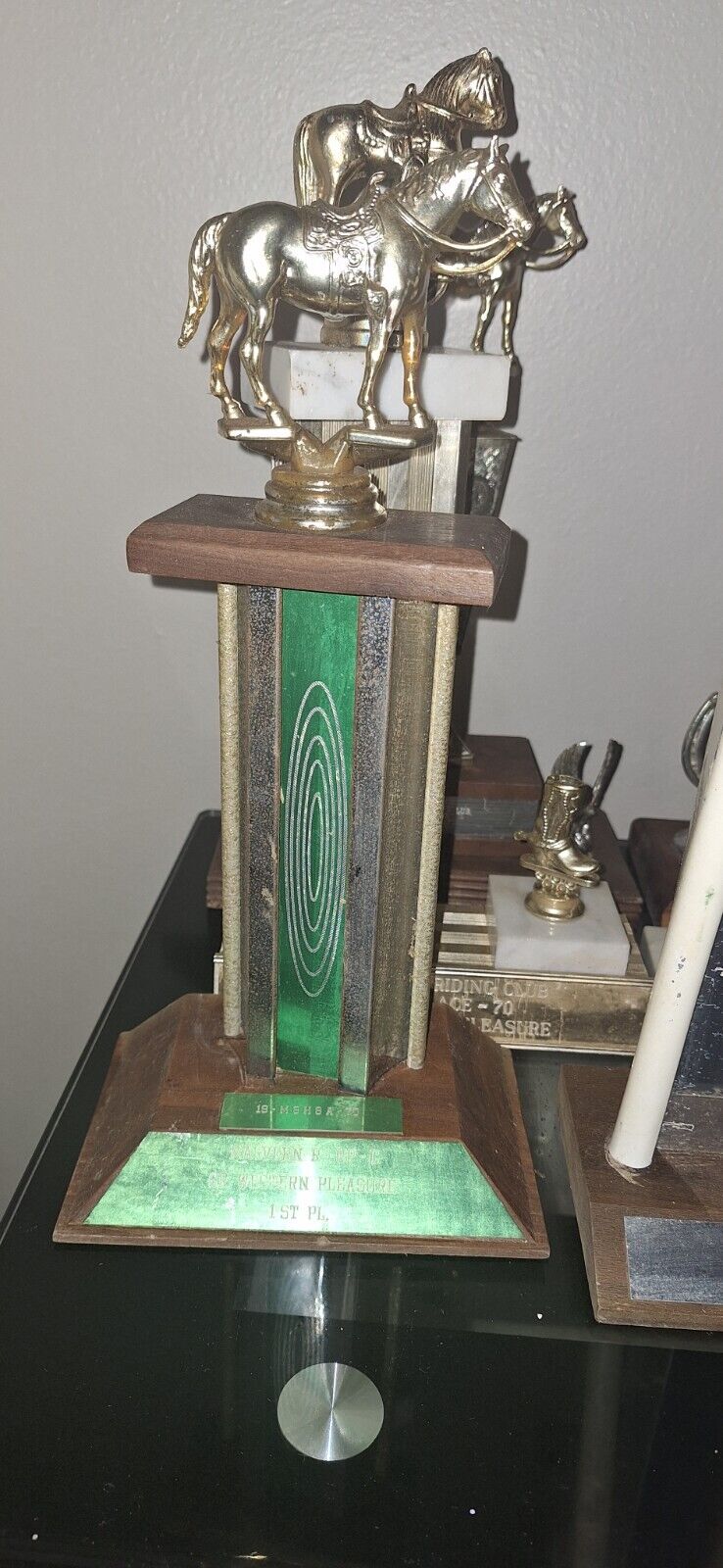 old trophies recognizing the best horsemanship, best mount, best horse and be