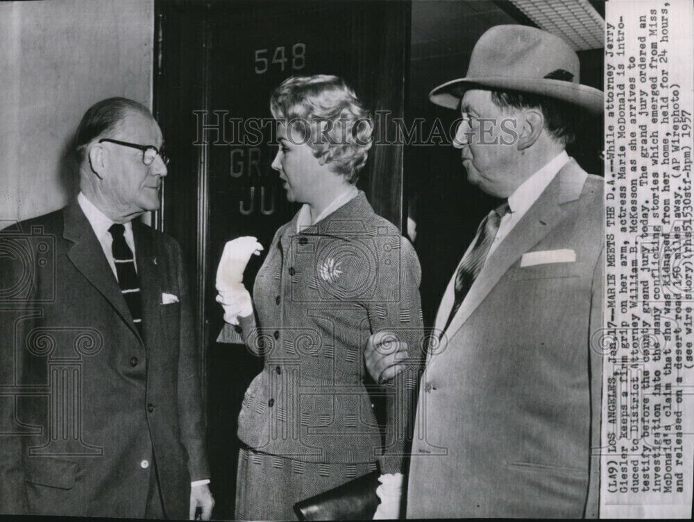 1957 Wirephoto Attorney Jerry Geisler keeps grip on Marie McDonald orw02770 7X9