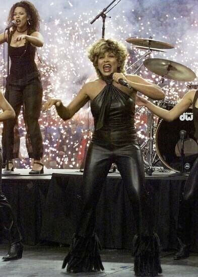 Tina Turner on stage singing in black leather outfit 5x7 inch photo