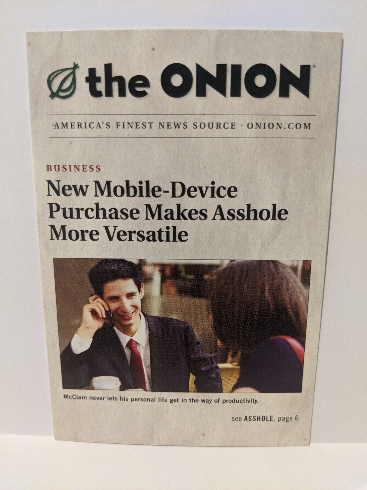 The Onion Postcard Funny Satire 2010 Mobile Device makes Aholes more versatile