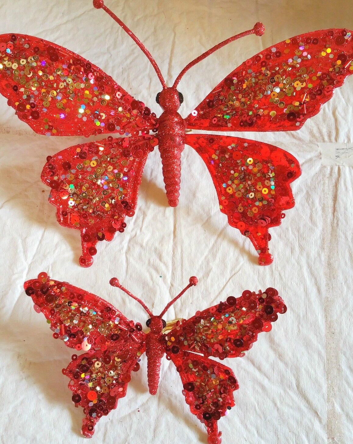 10 inch red sequin butterflies with spring clip 4 to a package Christmas Red Hat