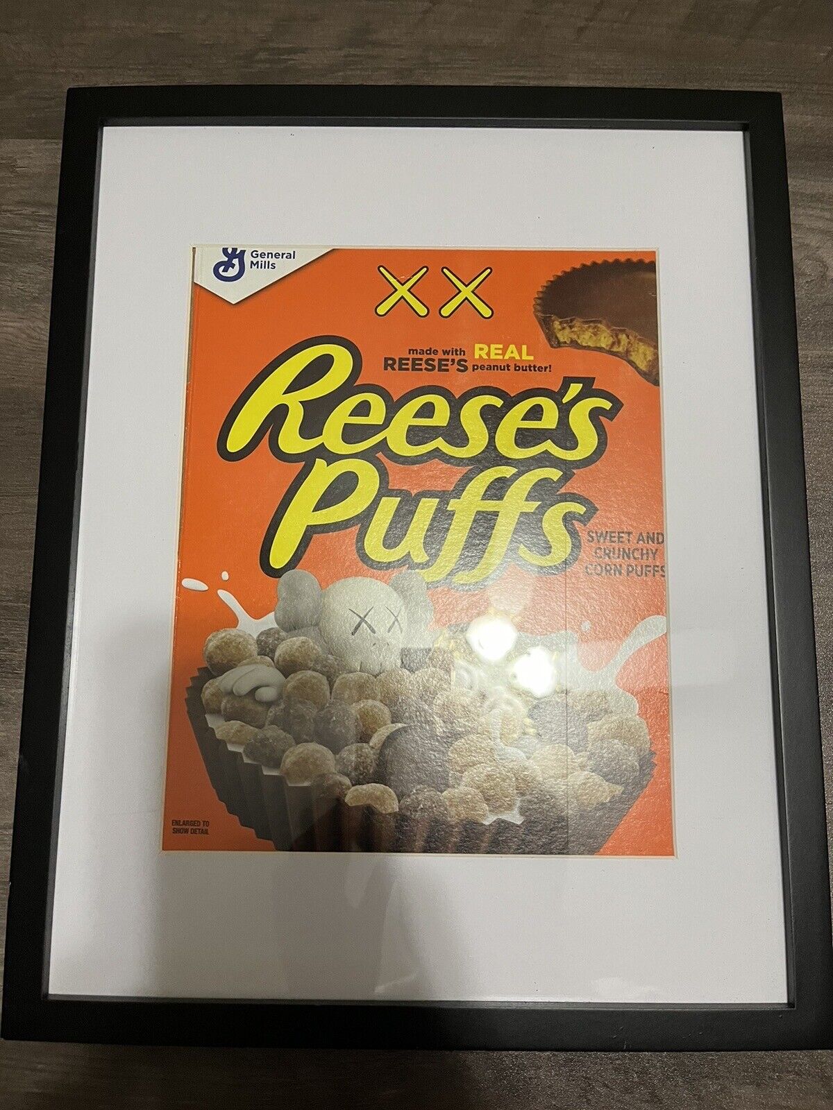 KAWS X Reeses Puffs Cereal Box (BRAND NEW UNOPENED) & Display W/frame