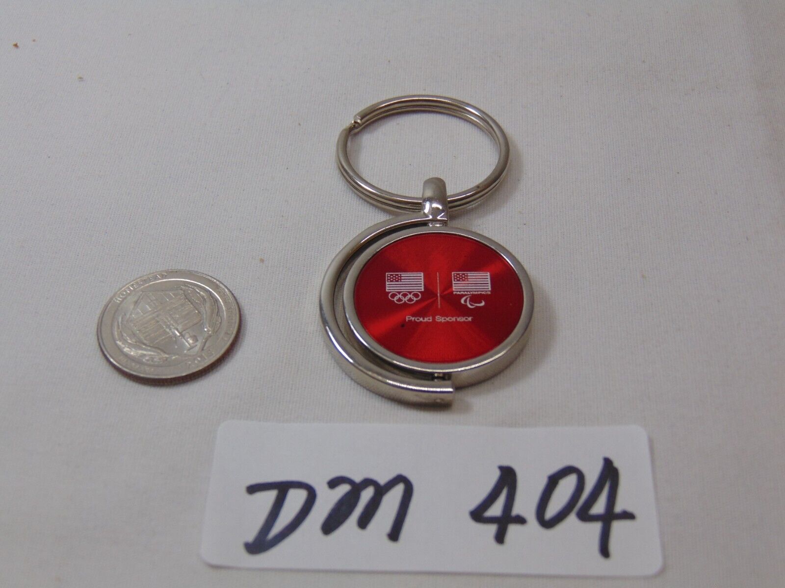 Vintage Keychain Key Ring Advertising USG Proud Sponsor Olympic Red Spinning
