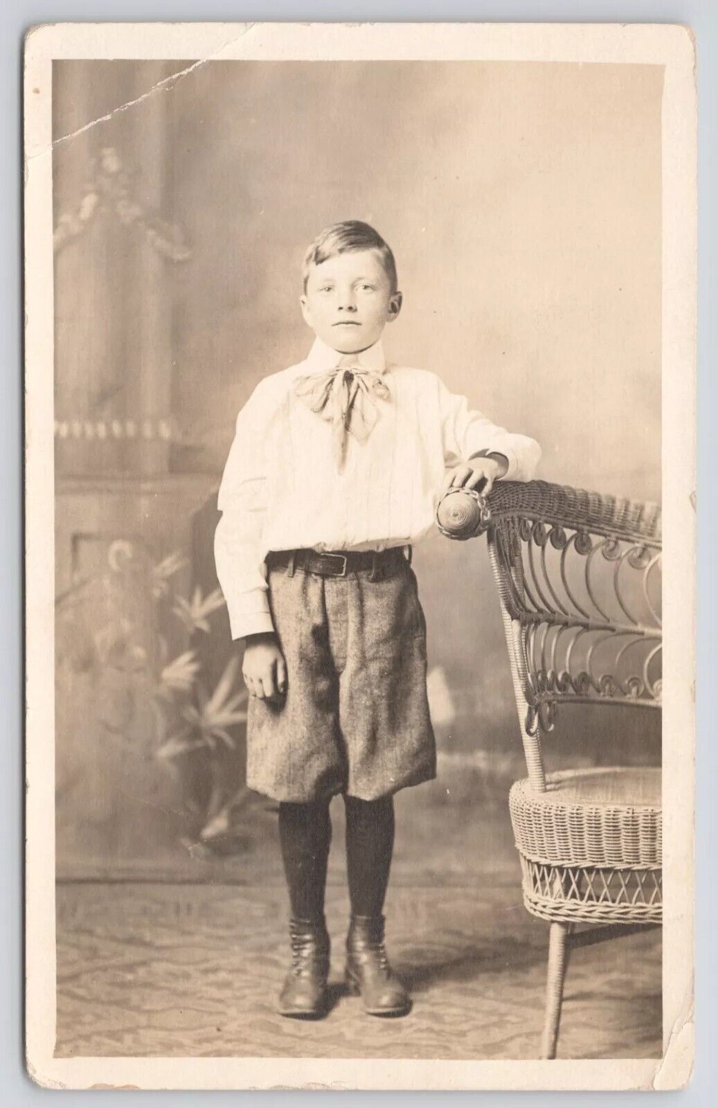RPPC Young Boy with Boots in  Studio Standing By Chair c1910 Real Photo Postcard