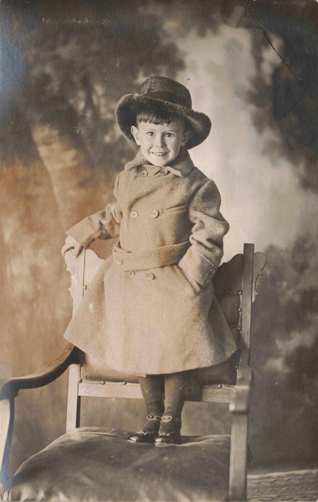 RPPC Happy Little Boy in Hat & Coat Stands on Chair Studio Portrait Postcard