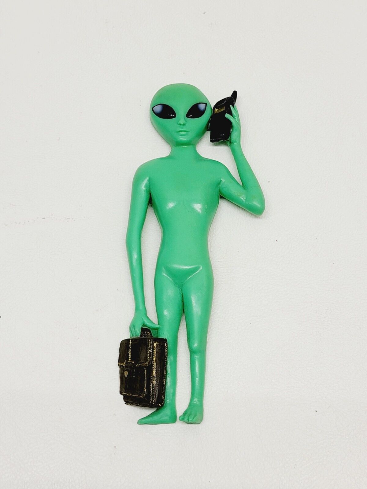 Green Alien Holding Cell Phone And Briefcase Magnet