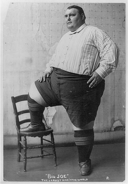 Big Joe' - the largest man in the world,obese man,foot on chair,c1903,obesity