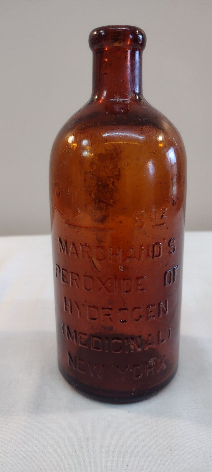 Antique Marchand\'s Embossed Med. Bottle 1800s
