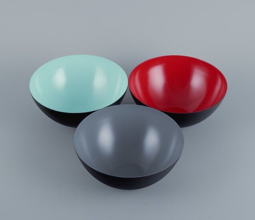 Three Krenit bowls in metal. Grey, red, mint green. Design by Hermann Krenchel