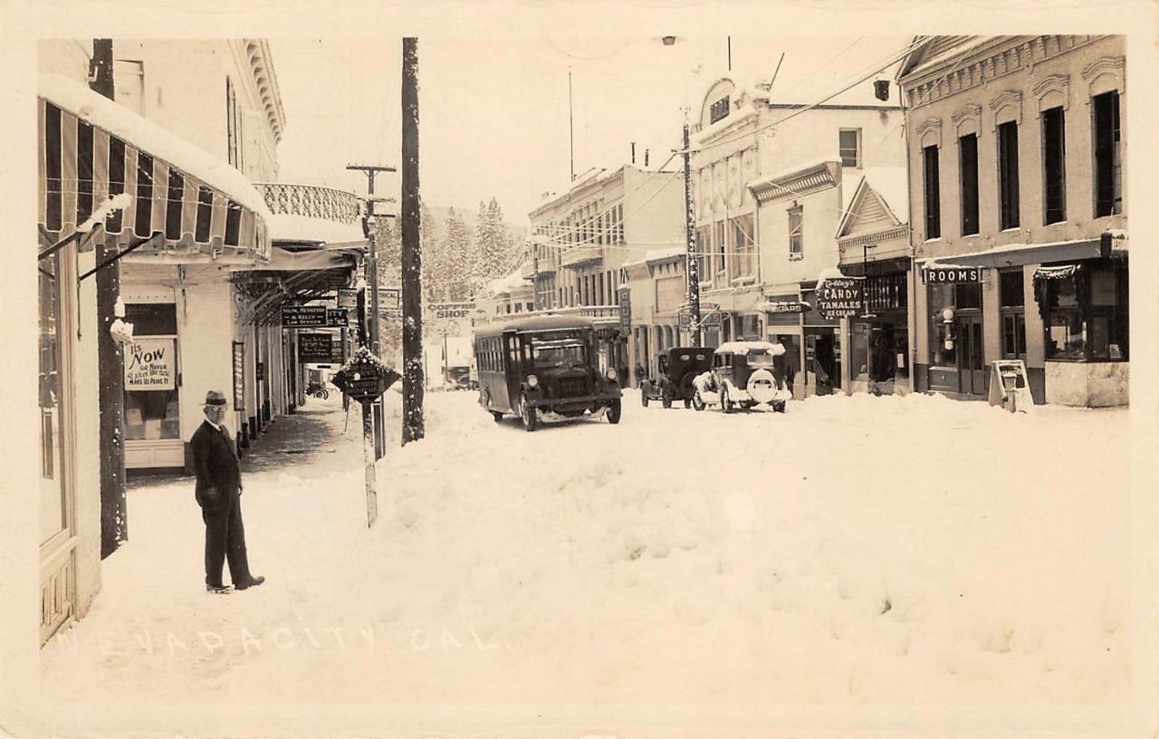 NEVADA CITY California RPPC Winter Street Scene Cars Signs 1930s Photo Postcard