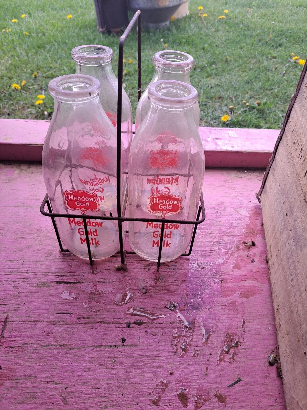 Lot Of 4 Vintage Glass Milk Bottles with Metal Carrier.