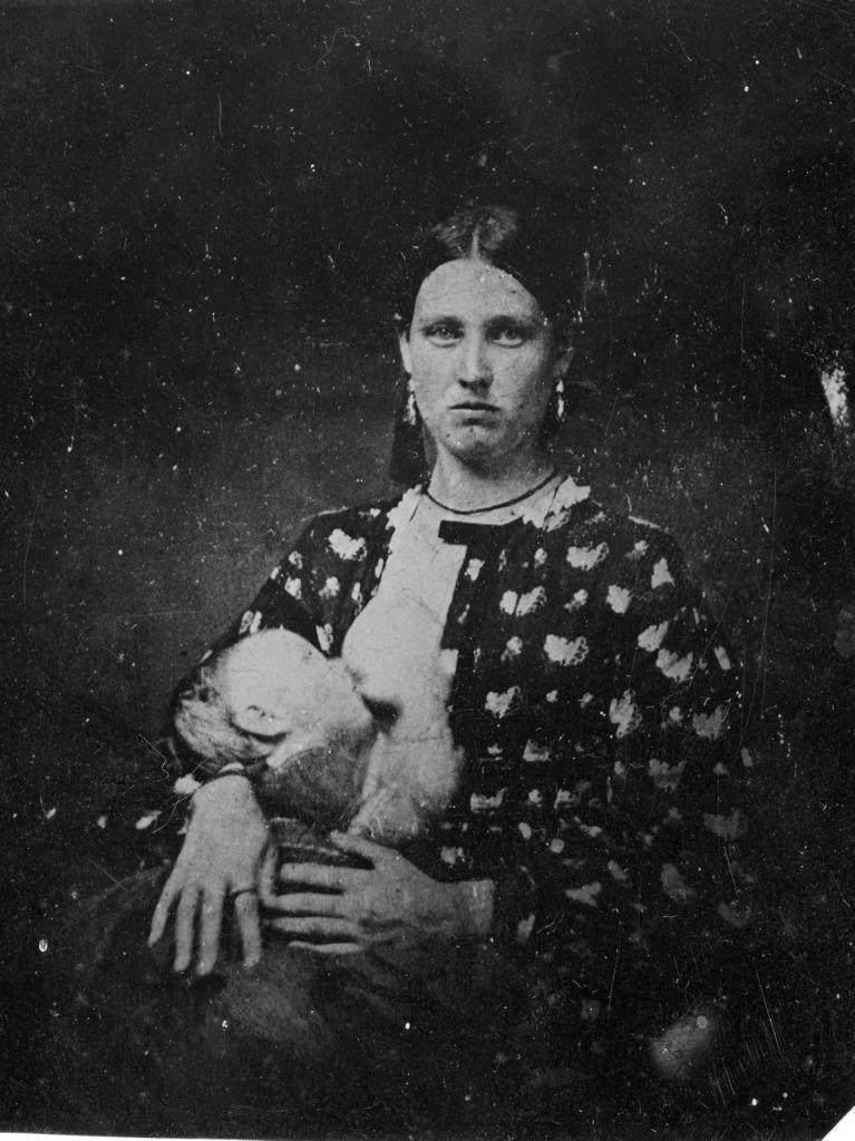 Photo. ca 1864. Woman Breastfeeding an Infant