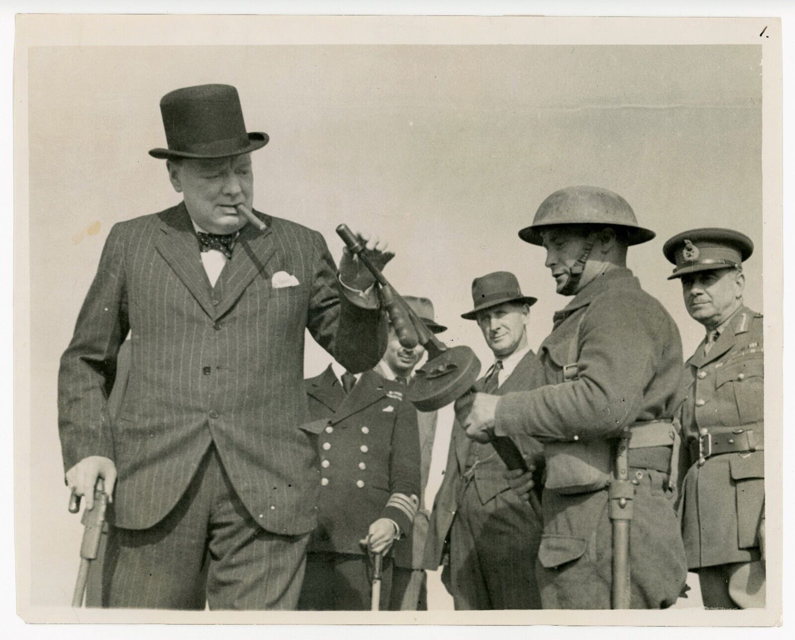 13 August 1940 press photo of Churchill examining a Thompson submachine gun