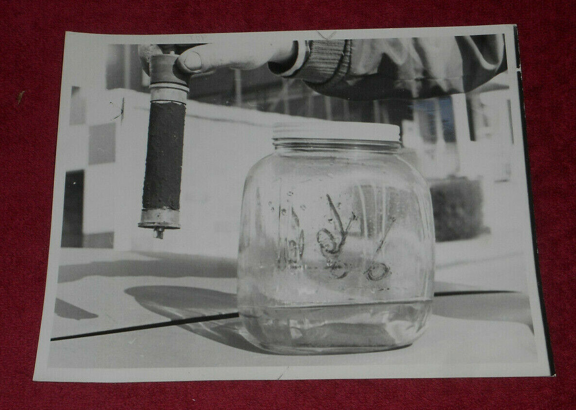 1967 Press Photo Lead Candle & Glass Jug Used In Air Pollution Study