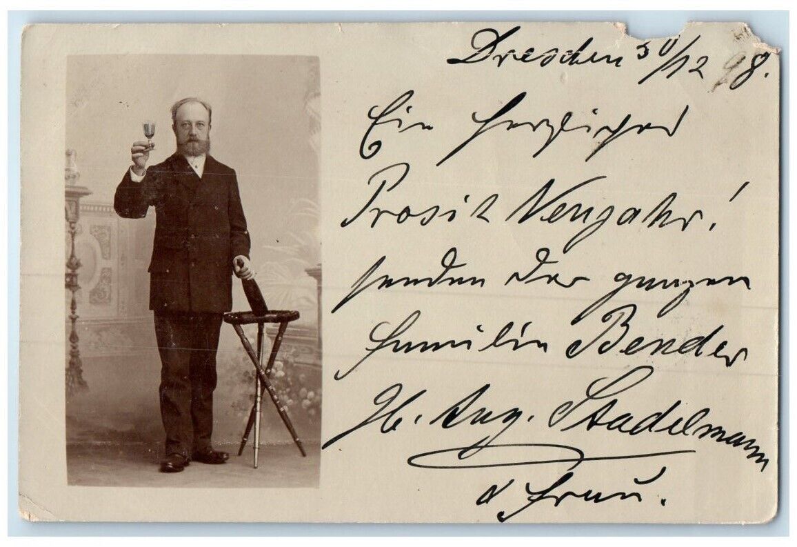 1898 Man Drinking Alcohol Wine Bottle Glass Dresden Germany RPPC Photo Postcard