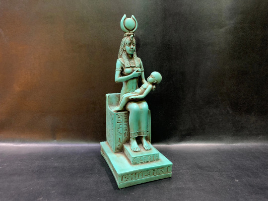 Isis goddess of healing and magic & motherhood breastfeeding her son