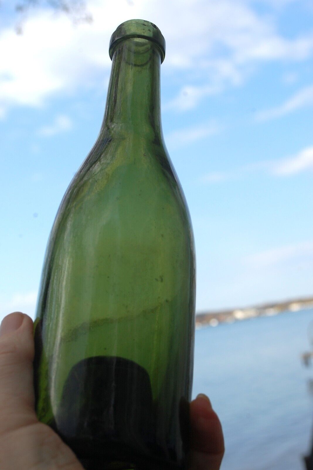 Dark green, champagne finish, vintage wine bottle, from the mid-1800s