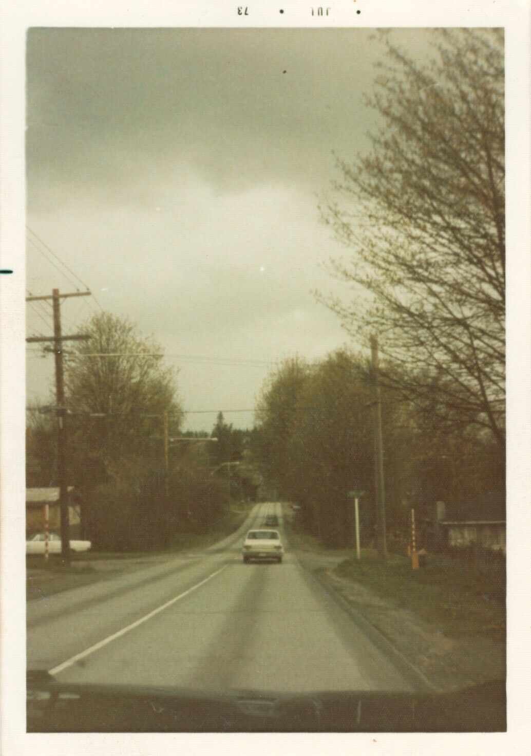 Vintage Photograph Driving rural route on overcast day in 1973