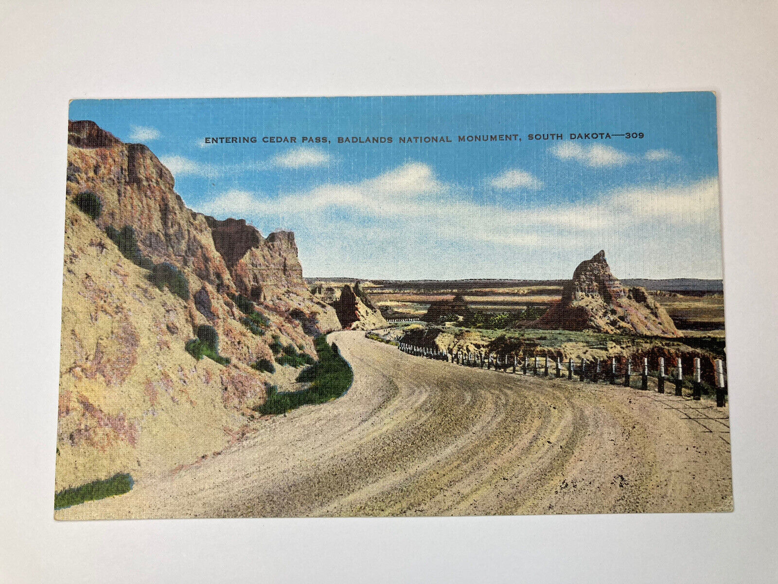 Entering Cedar Pass Badlands National Monument South Dakota VINTAGE Postcard