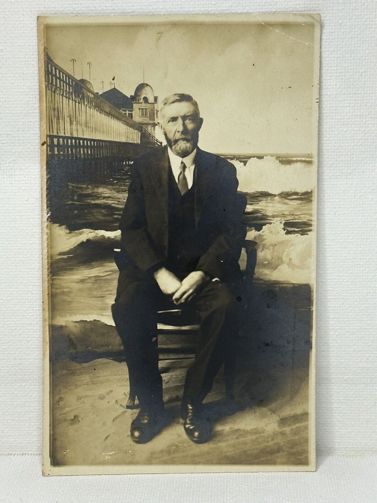 RPPC ~ Handsome Man In Suit Sitting In front Of Ocean Backdrop ~ Real Photo