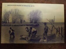 Vintage 1914 Blue Photo Catching Sturgeon Grasston Minnesota DPO Postcard  picture