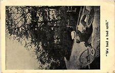 Vintage Postcard- A couple laying next to a broken bicycle, We had a bad spill picture